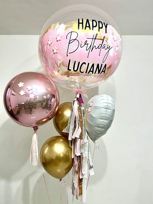 1 Globo Burbuja + 1 Orbz + 2 Globos Látex + 1 Corazón Metálico + Florecitas